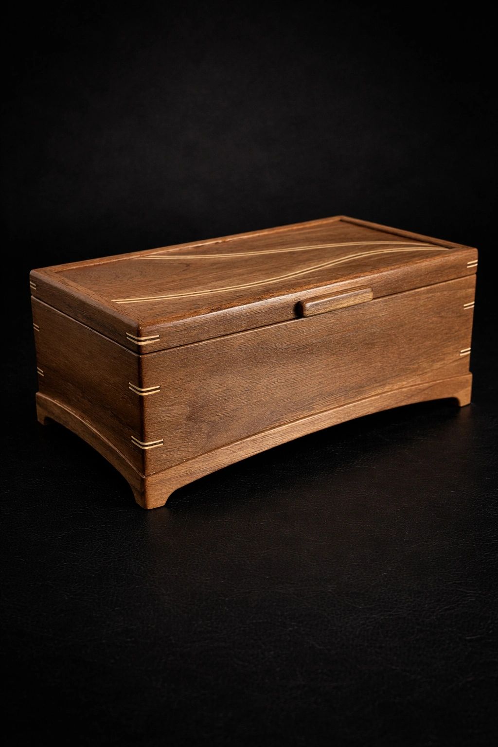 Elegant wooden box with intricate detailing.