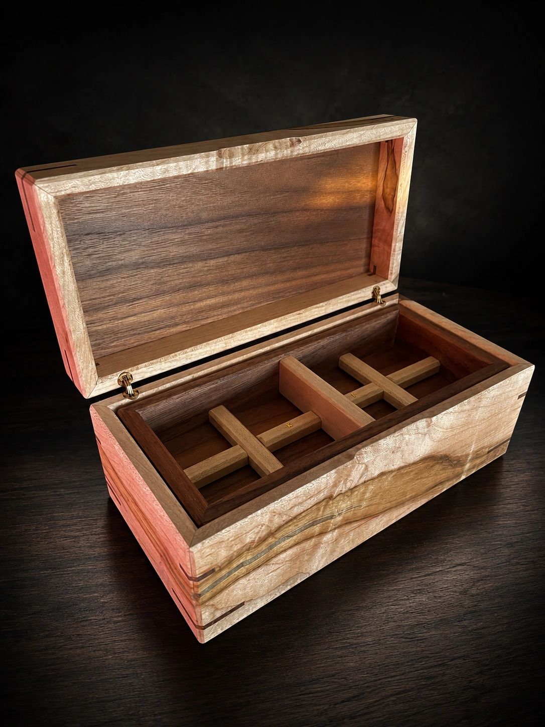 Beautiful handcrafted wooden box with open lid showing compartments.