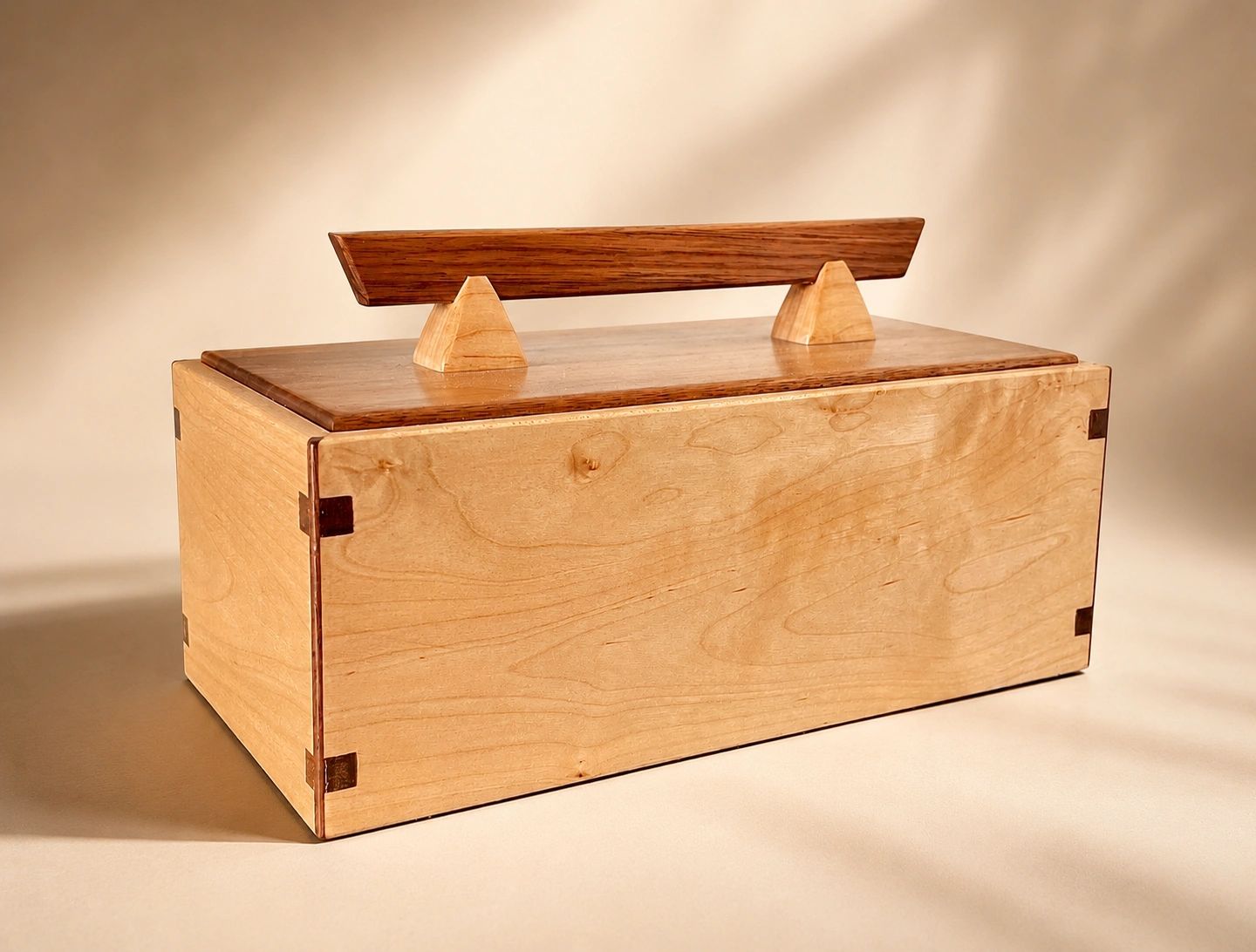 Elegant wooden jewelry or keepsake box with unique handle.