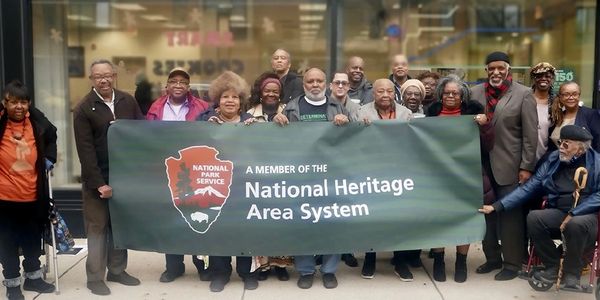 Group holding National Heritage Area System banner.