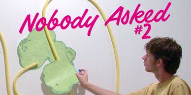 Person playing a unique wall game titled Nobody Asked #2.
