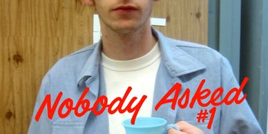 Person holding a blue cup with text 'Nobody Asked #1'.