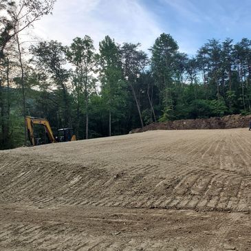 Grading and dirt work performed for a build site.