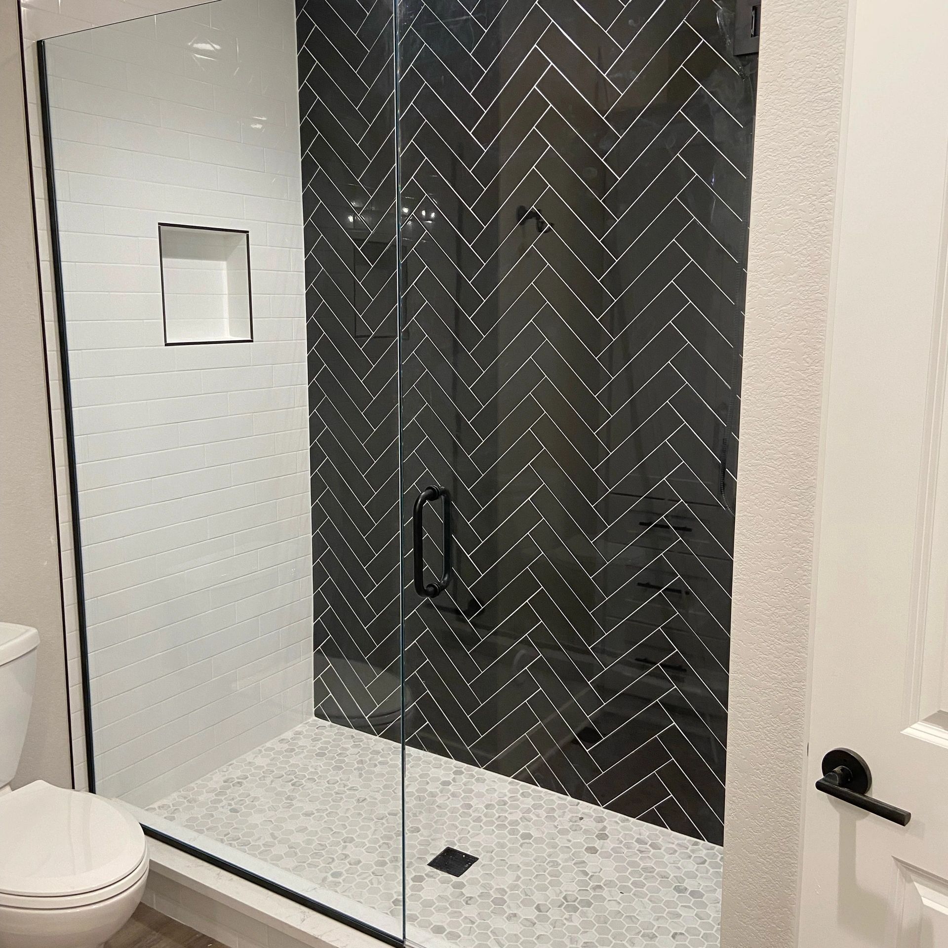 Herringbone tile bathroom finish