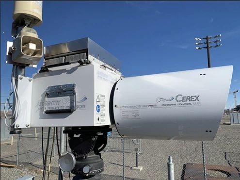 Figure 1. The open-path Cerex AirSentry FTIR sends a beam of infrared light through the open air to a retro-reflector, which reflects it back to the analyzer. The FTIR then measures and records the light absorption due to target gases. Figure 1. The open-path Cerex AirSentry FTIR sends a beam of infrared light through the open air to a retro-reflector, which reflects it back to the analyzer. The FTIR then measures and records the light absorption due to target gases.
