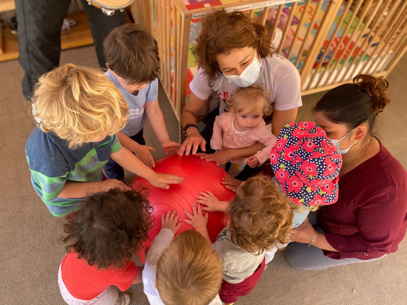 A group of children and instructors at circle time.