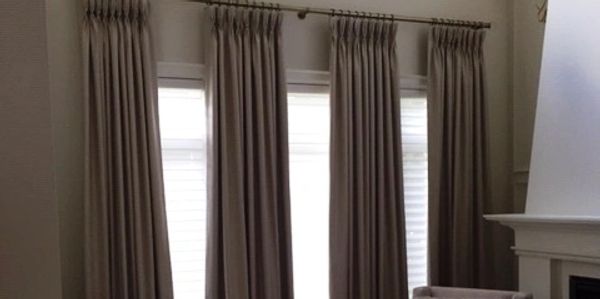 living room drapery
drapery for tall windows
silhouette shades
pinch pleat drapery 
banded drapery
