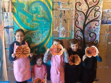 Art workshop at the Purposeful Painting studio with mixed age group, creating the Monarch butterfly.