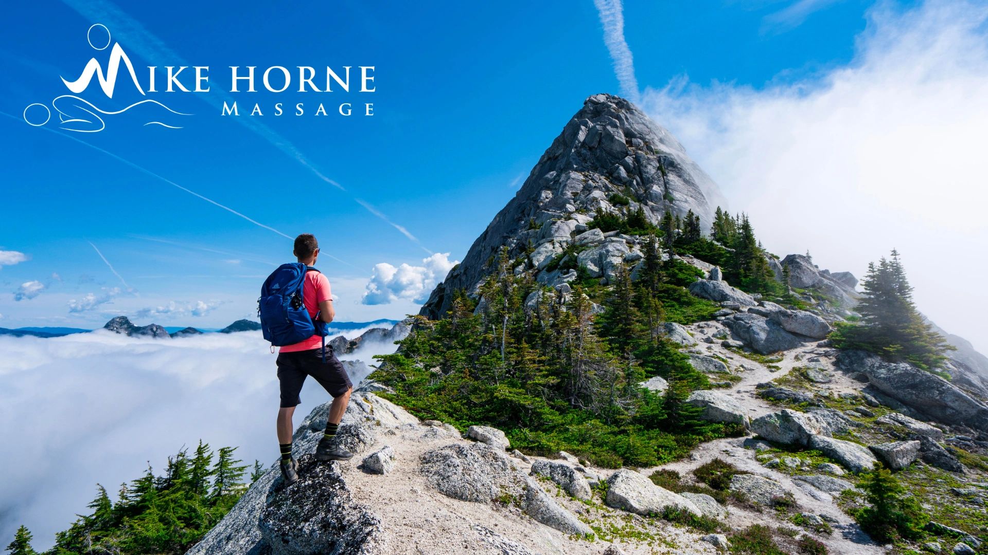 guy on a mountain with logo in the corner