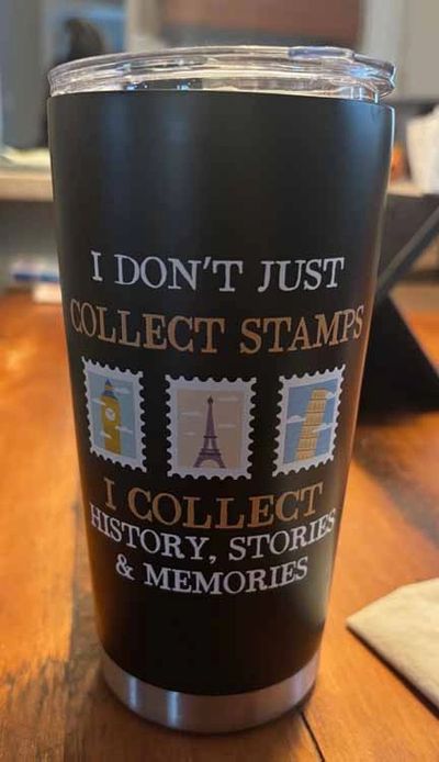 Travel-themed tumbler with a quote about collecting memories, not just stamps.