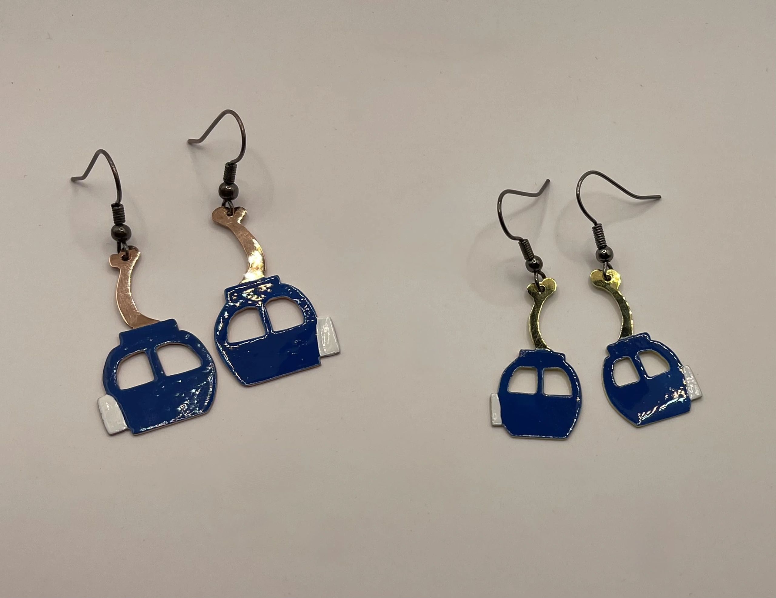 painted mini telecabines (ski gondolas) in brass as earrings