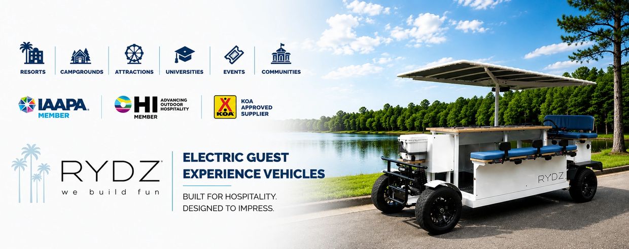 Electric guest experience vehicle by RYDZ overlooking a lake.
