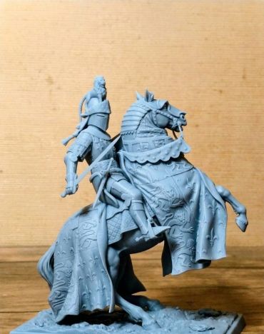 Detailed miniature knight on a rearing horse.