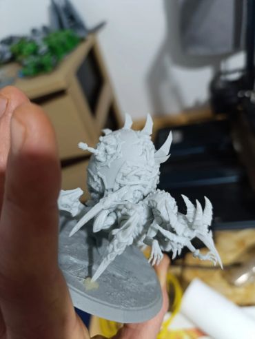 Unpainted intricate miniature model with multiple clawed limbs.