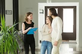 A couple meeting with a rental expert.