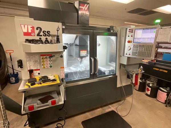 Picture of the CNC machine inside Pacific Coast Optics.