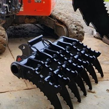 Black heavy-duty excavator grapple attachment.