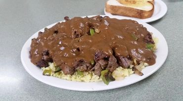 Steak Bites with brown gravy and rice