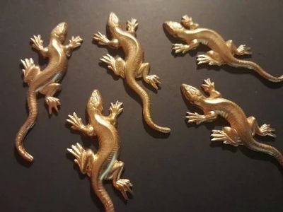 group of stamped brass lizard pendants