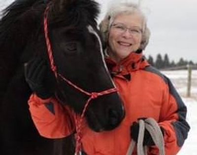 closeup shot of a woman with a horse 