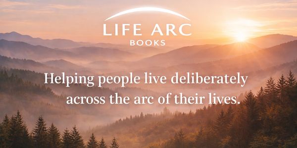 Life Arc Books logo above a sunrise over misty forested mountains, symbolizing authoring your life through personal development books and self-help tools.