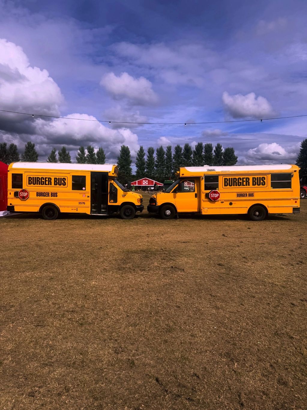 Two food trucks at a festival