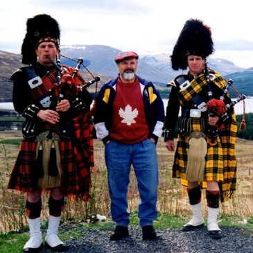 Roy McGuinness (father-in-law) with two Highland Pipers.