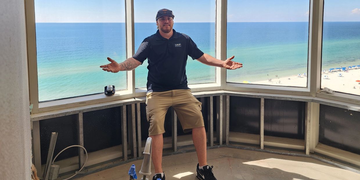 Posing in a newly demoed tub room atop a massive condo in Orange Beach.