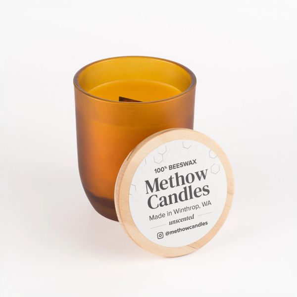 Amber glass beeswax candle with wooden lid from Methow Candles.