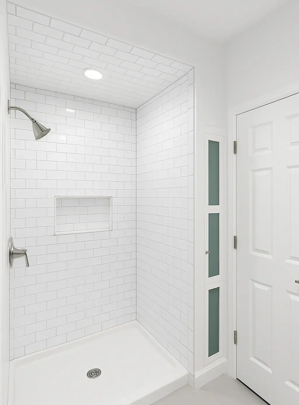 Bathroom remodeling in Tampa with a tiled walk-in shower, white ceiling, and recessed niche