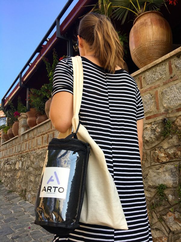 Arto Pillow in its carrying case, attached to a canvas bag.