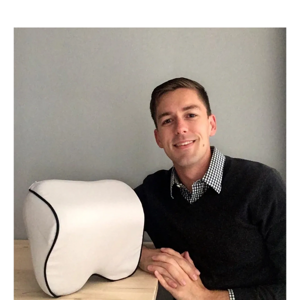 Erik, the Founder and CEO, with a tan Arto Pillow.