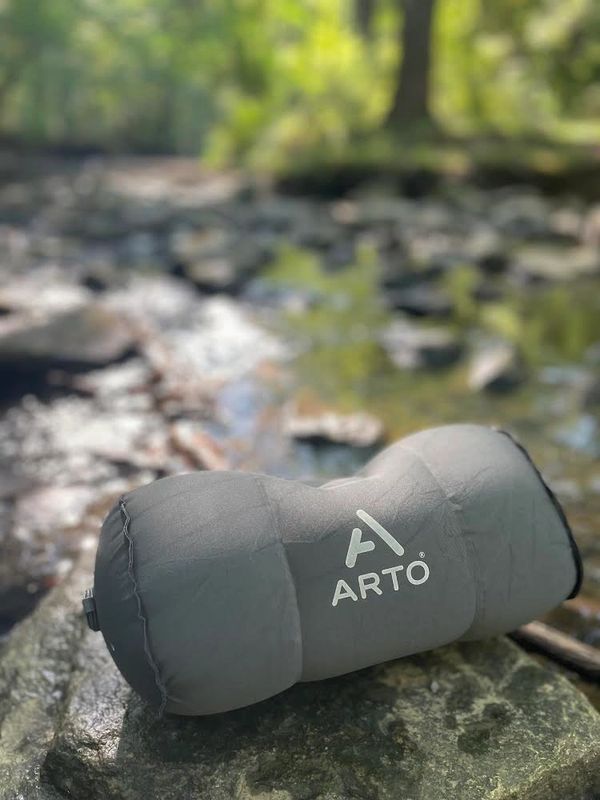 Arto Pillow - Inflatable sitting on a rock, in the middle of a forest. 
