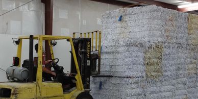 All shredded paper is baled and shipped to a manufacturing plant where it is recycled.