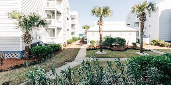 View of pool house and Bay from balcony