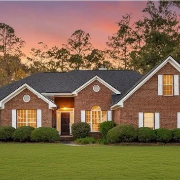 Brick house with newly painted trim, shutters, refinished mahogany door with new hardware.