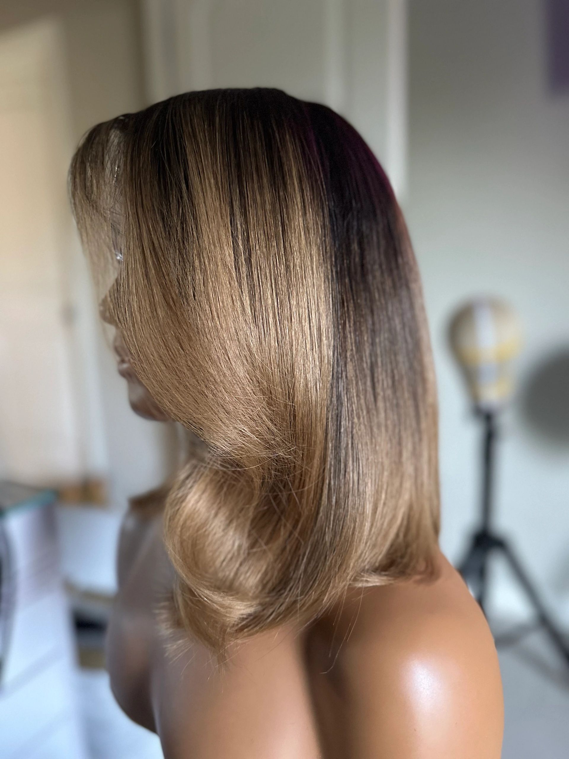 Side view of smooth, wavy light brown hair.