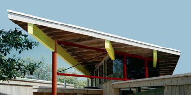 A beach house on Fire Island, New York.  Lap Pool. Great room. Tall sliders. Exposed beams.