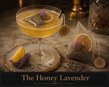 Elegant Honey Lavender cocktail with tea bag and garnish.
