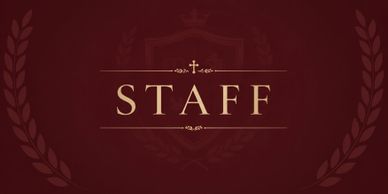 Elegant staff sign with gold lettering on a dark red background.