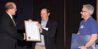 Our group receiving a Legislative Tribute signed by the Governor of Michigan for our adoption!