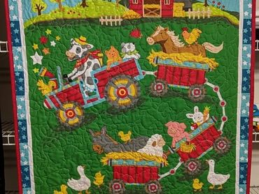 Baby Farm Animals Quilt 35"x42" with images of baby farm animals. Quilted with a counting sheep desi