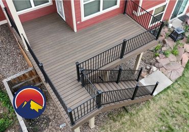 Finished custom deck in Highlands Ranch, CO with stylish railings and outdoor dining space.