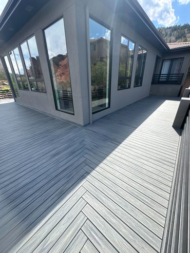 Custom deck project in Parker, CO, with a large seating area and a stunning backyard transformation