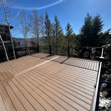Deckorators deck with steel railings outdoor living in Parker Colorado. Best Composite deck Builder