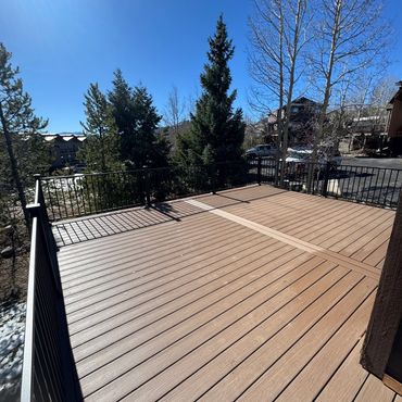 Deckorators deck with steel railings outdoor living in Parker Colorado. Best Composite deck Builder