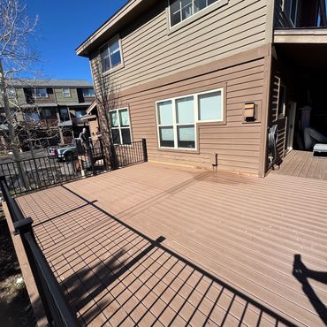 Deckorators deck with steel railings outdoor living in Parker Colorado. Best Composite deck Builder