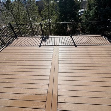 Deckorators deck with steel railings outdoor living in Parker Colorado. Best Composite deck Builder