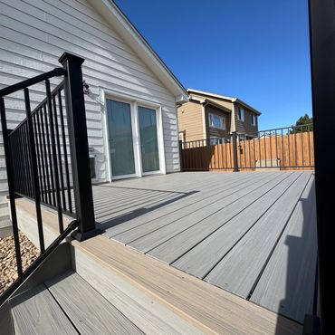 Deckorators deck with steel railings outdoor living in Parker Colorado. Best Composite deck Builder