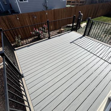 Deckorators deck with steel railings outdoor living in Parker Colorado. Best Composite deck Builder